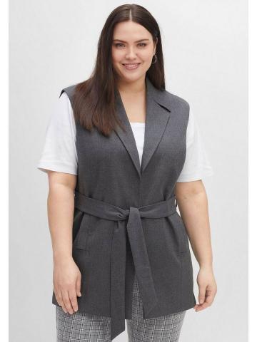 Длинный жилет