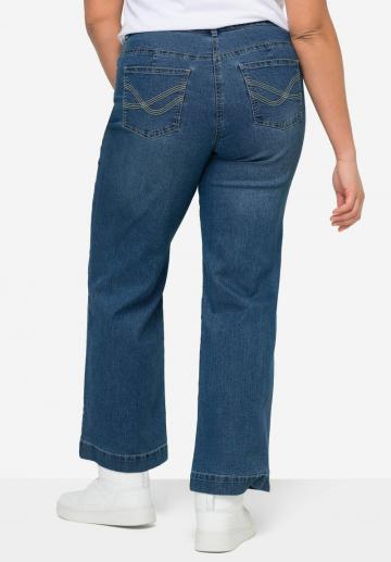 Клешеные джинсы