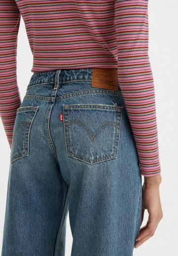 Клешеные джинсы