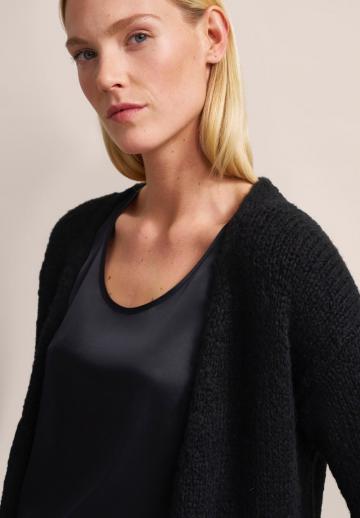 Длинный жилет