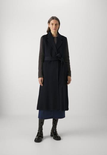 Длинный жилет