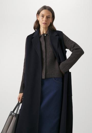 Длинный жилет