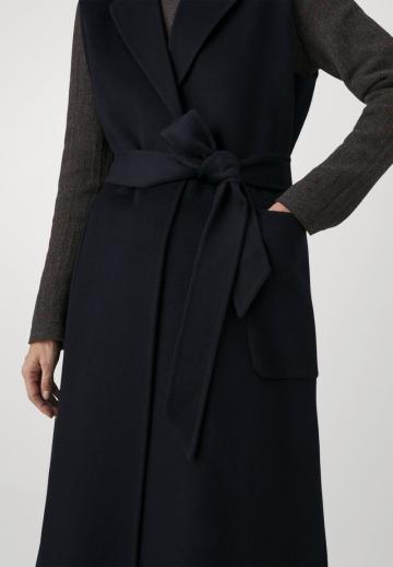 Длинный жилет