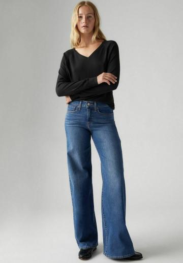 Клешеные джинсы