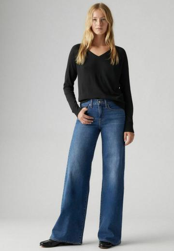 Клешеные джинсы