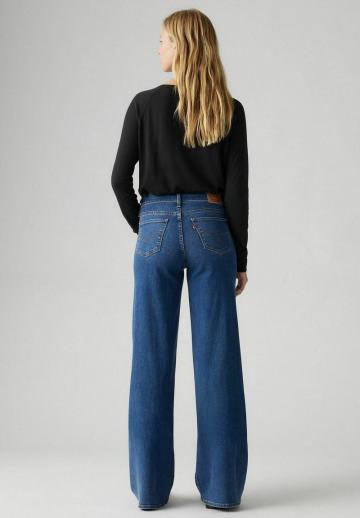 Клешеные джинсы