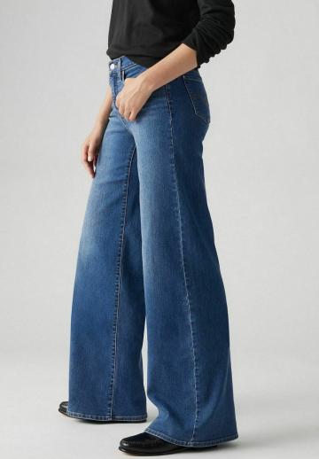 Клешеные джинсы