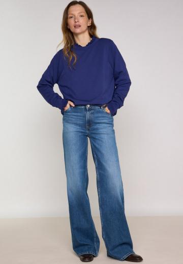 Клешеные джинсы