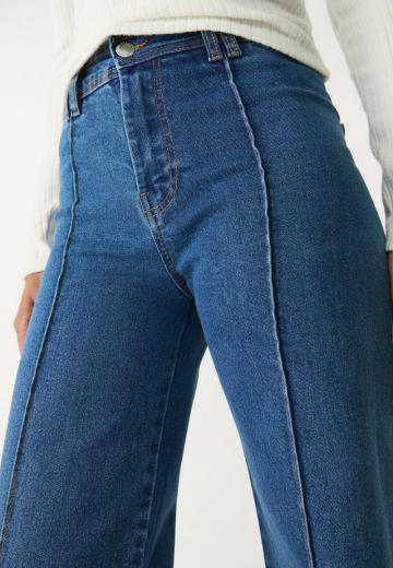 Клешеные джинсы