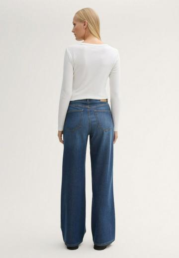 Клешеные джинсы