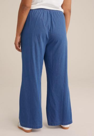 Клешеные джинсы