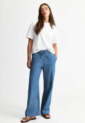 Клешеные джинсы