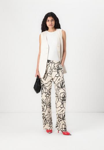 Длинный жилет