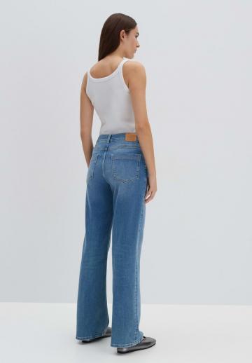 Клешеные джинсы