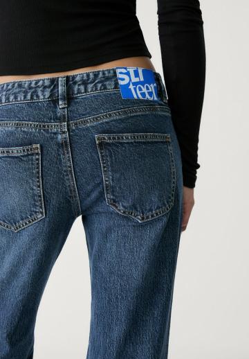 Клешеные джинсы