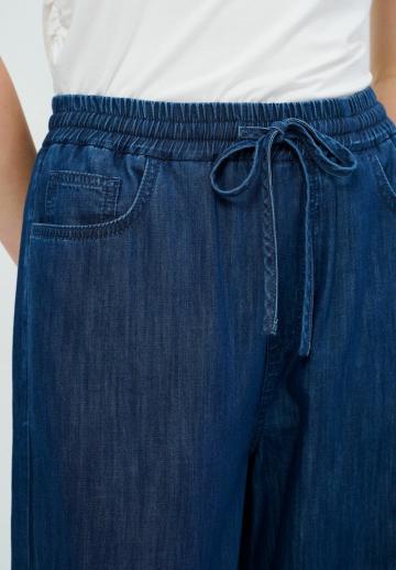 Клешеные джинсы