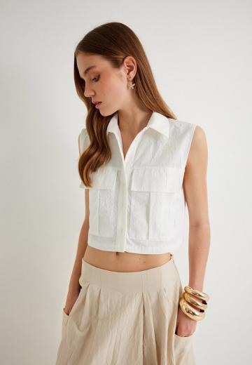 Блузка без рукавов