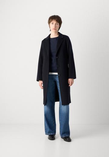 Клешеные джинсы