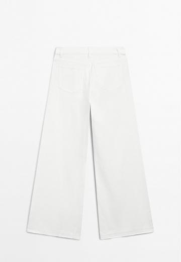 Клешеные джинсы