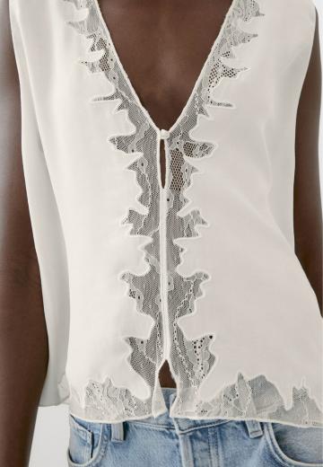 Блузка без рукавов