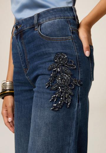 Клешеные джинсы