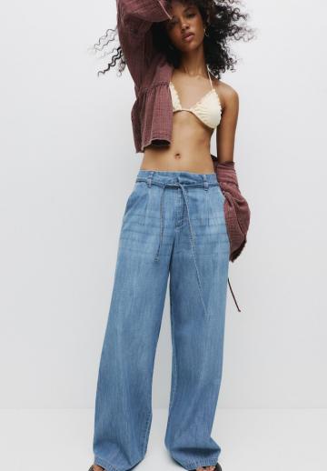 Клешеные джинсы