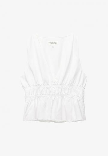 Блузка без рукавов