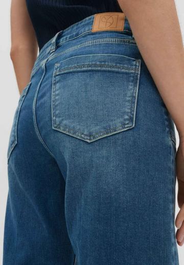 Клешеные джинсы