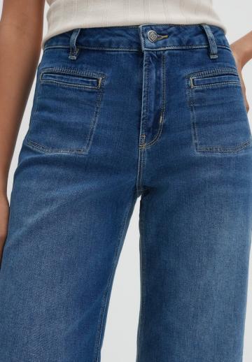 Клешеные джинсы