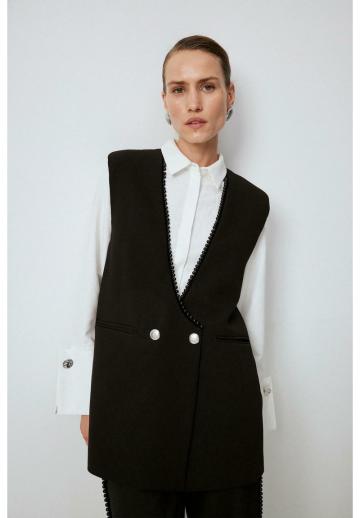 Длинный жилет