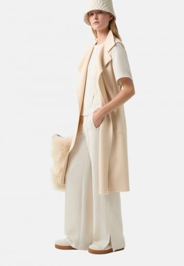 Длинный жилет