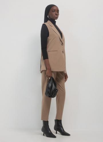 Длинный жилет