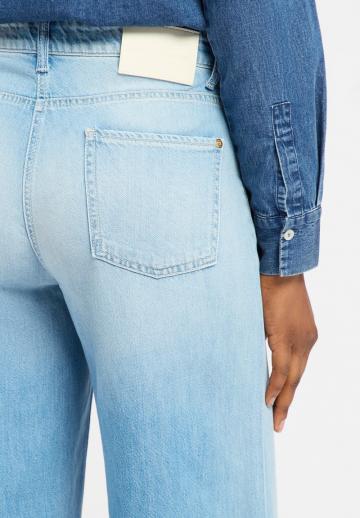 Клешеные джинсы