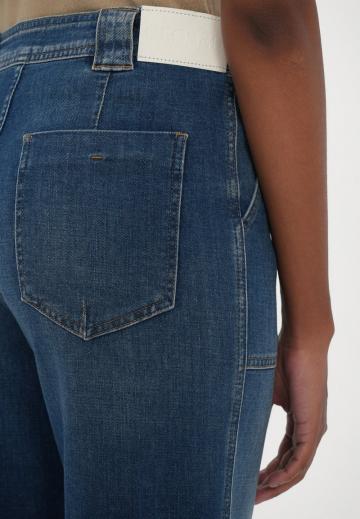 Клешеные джинсы