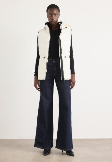 Длинный жилет