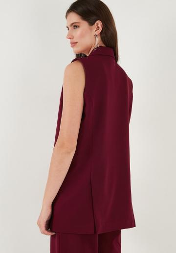 Длинный жилет