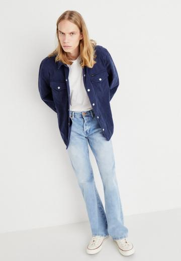 Клешеные джинсы