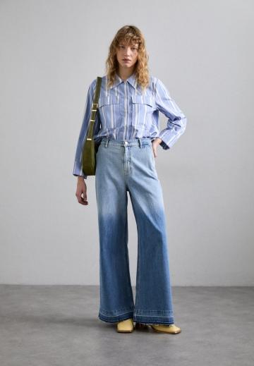 Клешеные джинсы