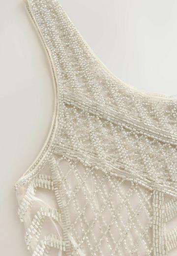 Блузка без рукавов