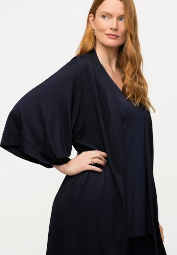 Длинный жилет