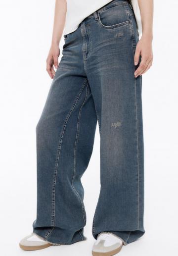 Клешеные джинсы