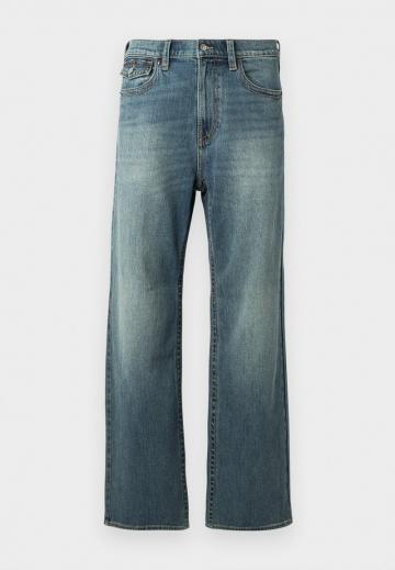 Клешеные джинсы