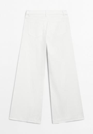 Клешеные джинсы