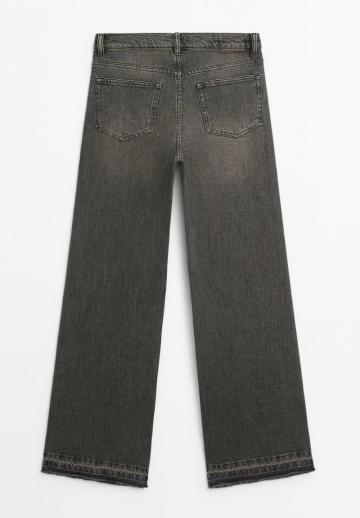 Клешеные джинсы