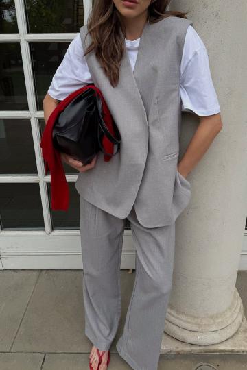 Длинный жилет