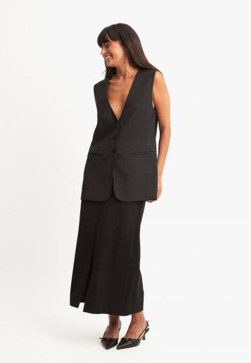 Длинный жилет