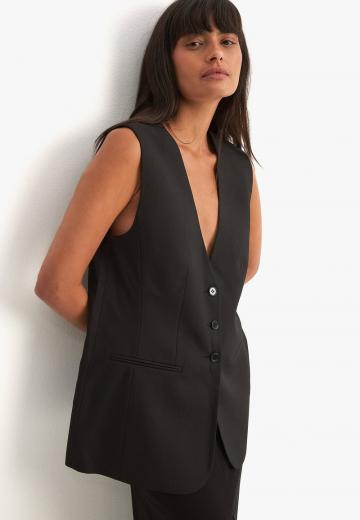 Длинный жилет