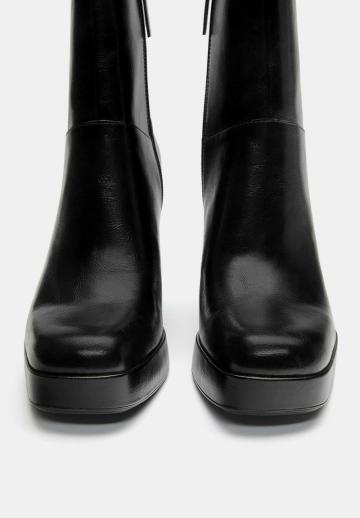 Высокие сапоги