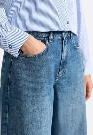 Клешеные джинсы