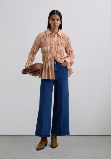 Клешеные джинсы